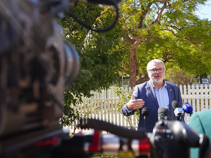 CEO Mark Glasson speaking to media cameras with a suburban background.